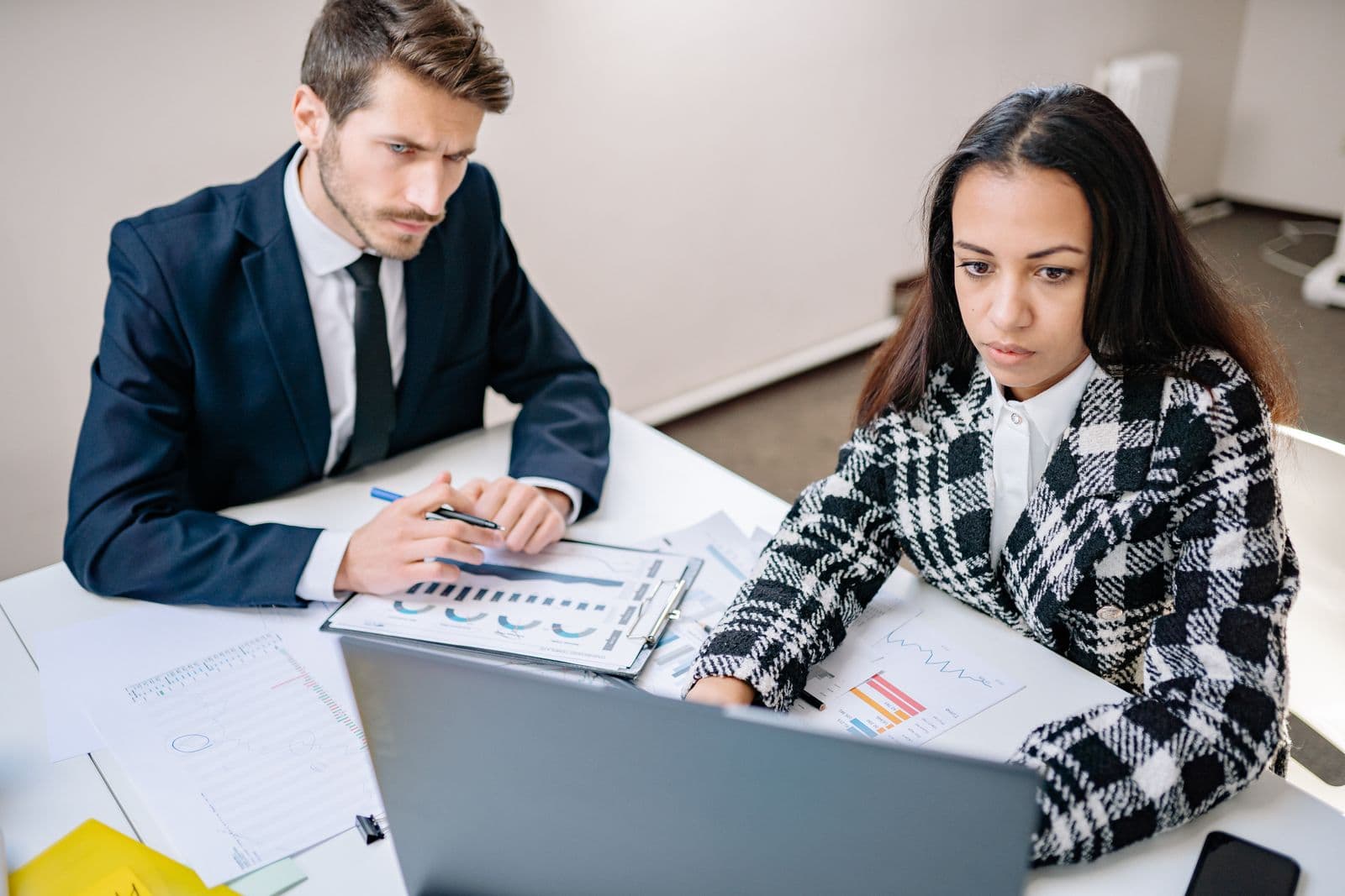 Two professionals reviewing SEO results together